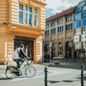 architect riding bicycle city