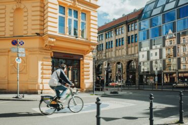 architect riding bicycle city