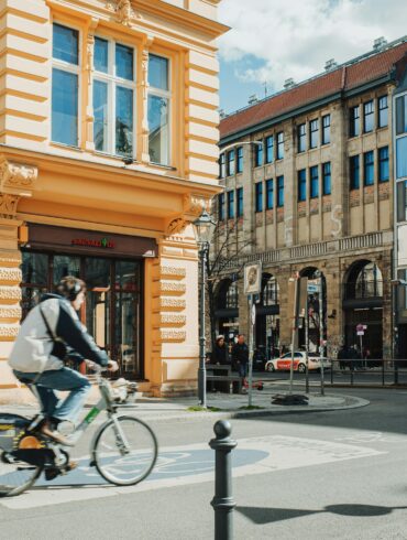 architect riding bicycle city