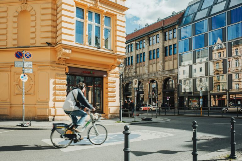 architect riding bicycle city