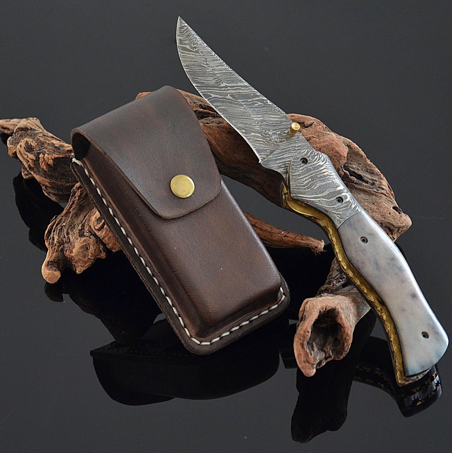 Bespoke artisan leatherworking tools bathed in soft tropical