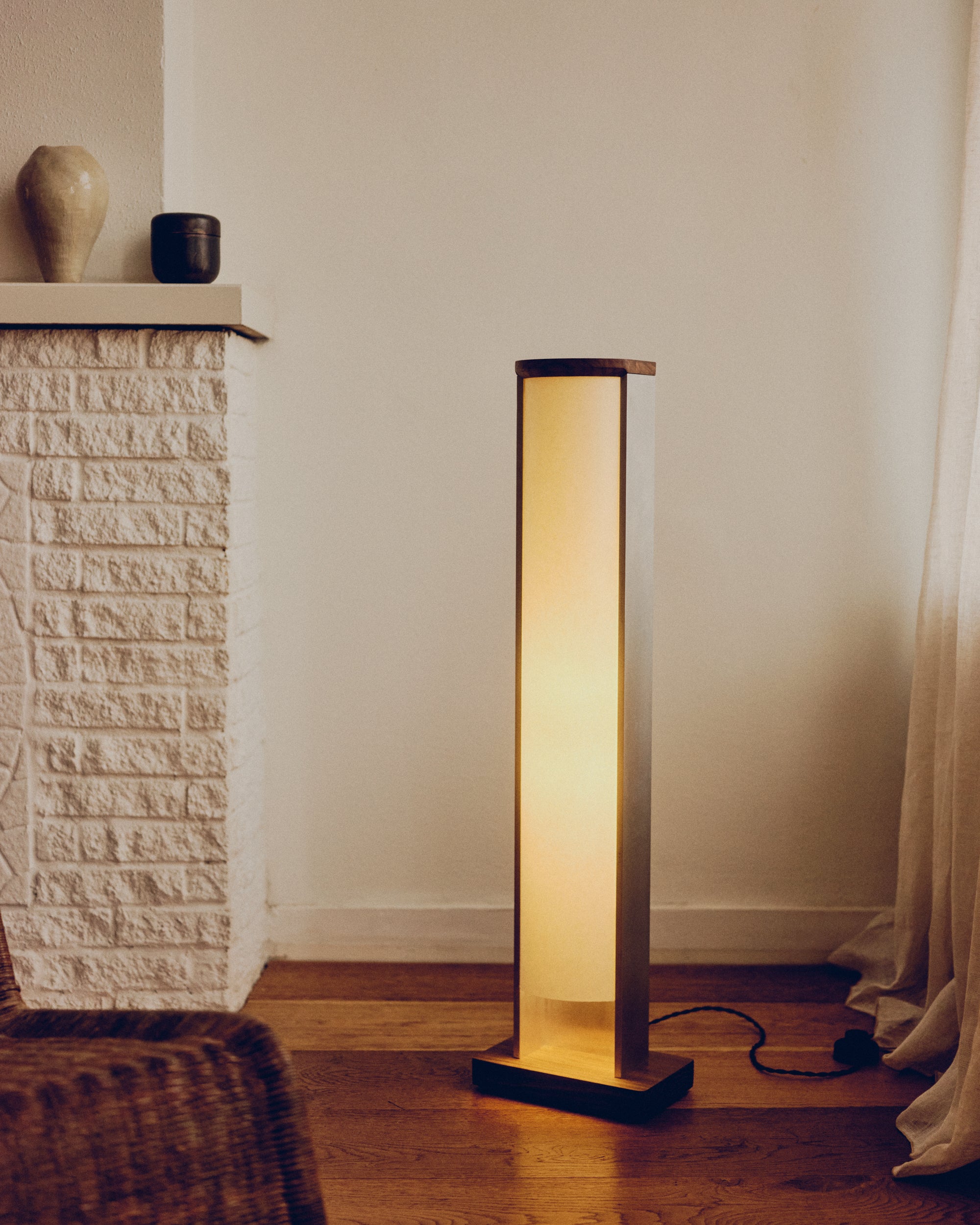 Sculptural recycled aluminum floor lamp in a minimalist