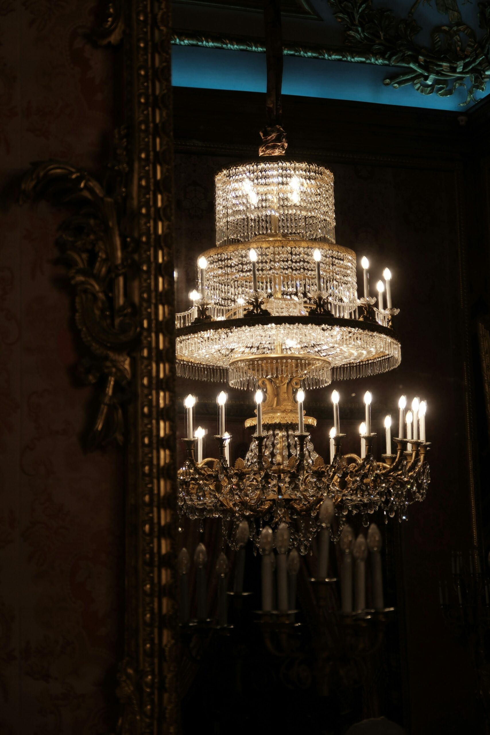 antique crystal chandelier in a room with dark