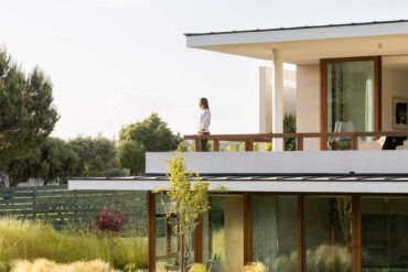 discreet modern architecture blending into natural landscape