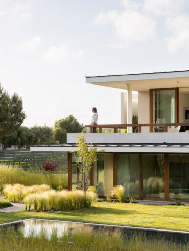 discreet modern architecture blending into natural landscape