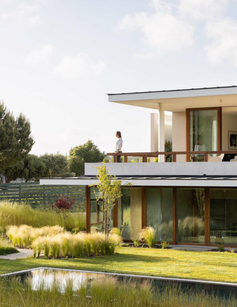 discreet modern architecture blending into natural landscape