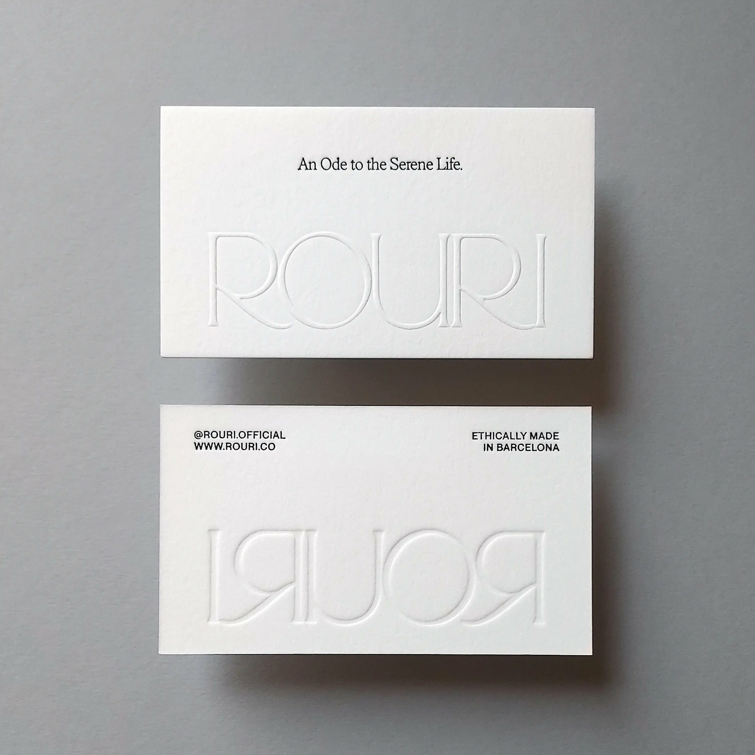 embossed minimalist typography on heavy cotton paper
