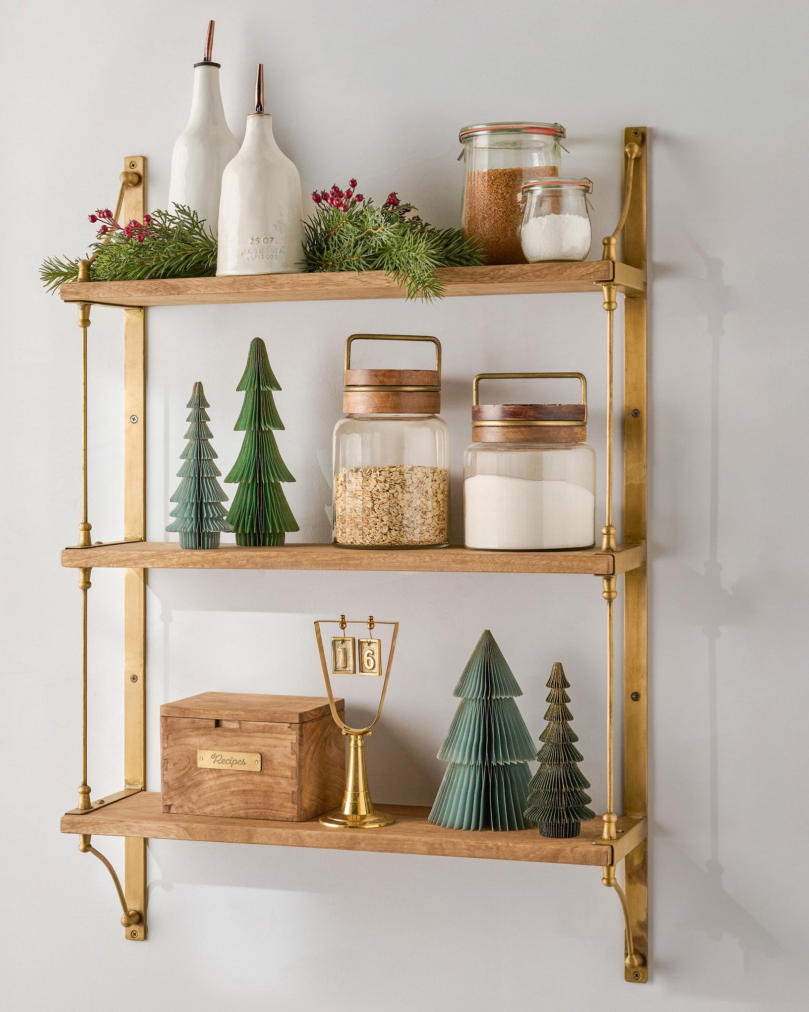 warm earthy tones and brushed brass display shelves