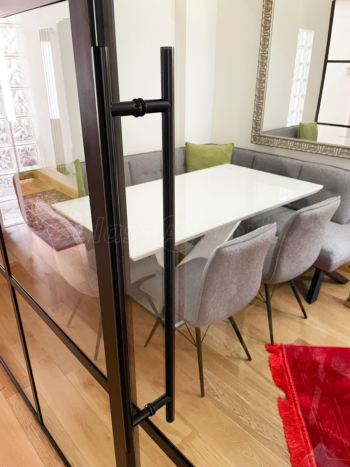 black steel frame indoor glass partition separating modern