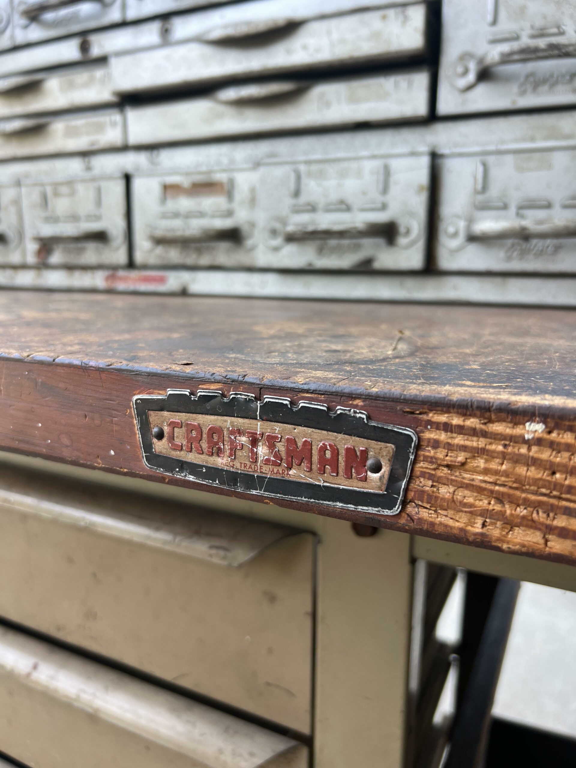 craftsman tools on an antique wooden workbench with