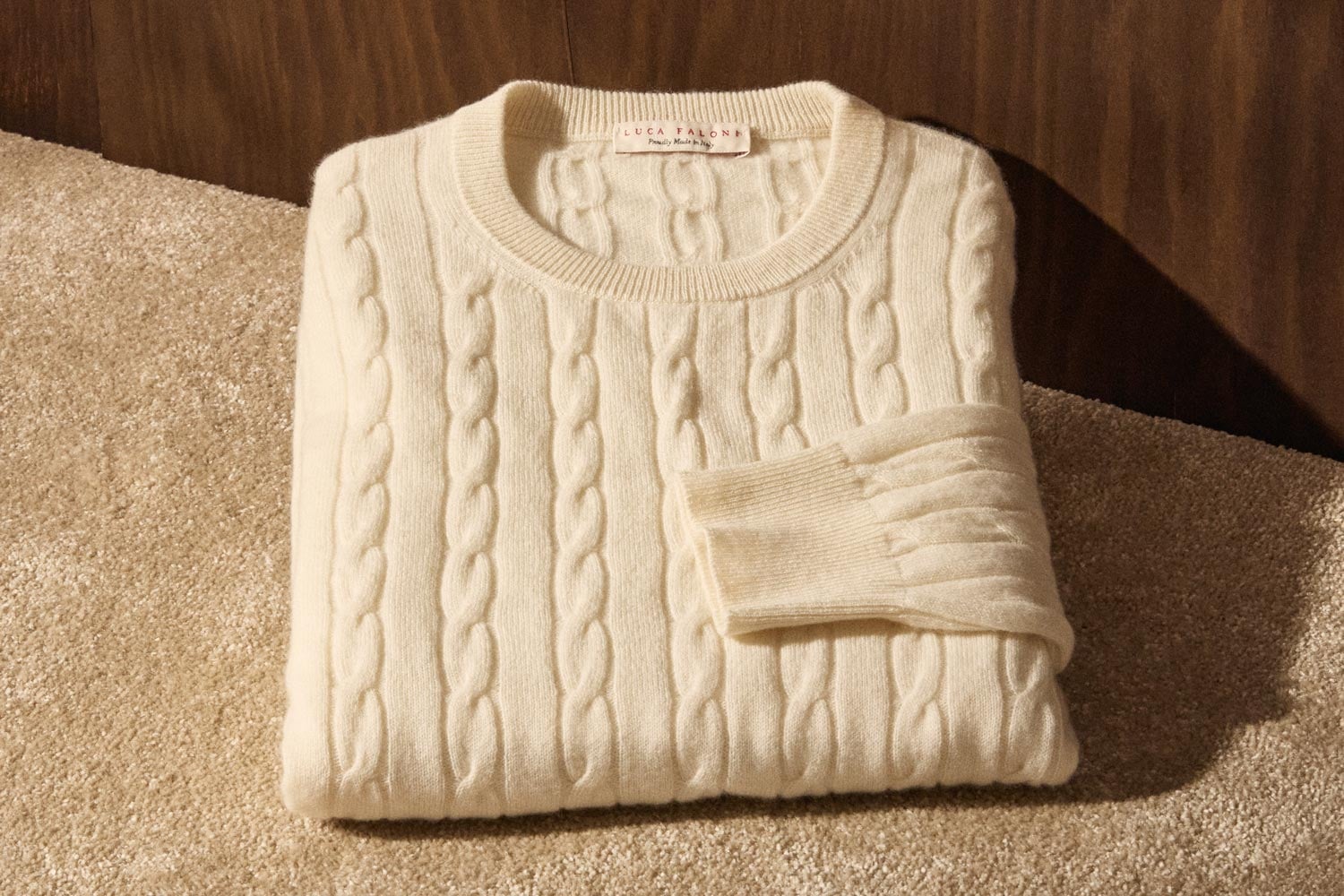 folded cream cashmere sweater texture