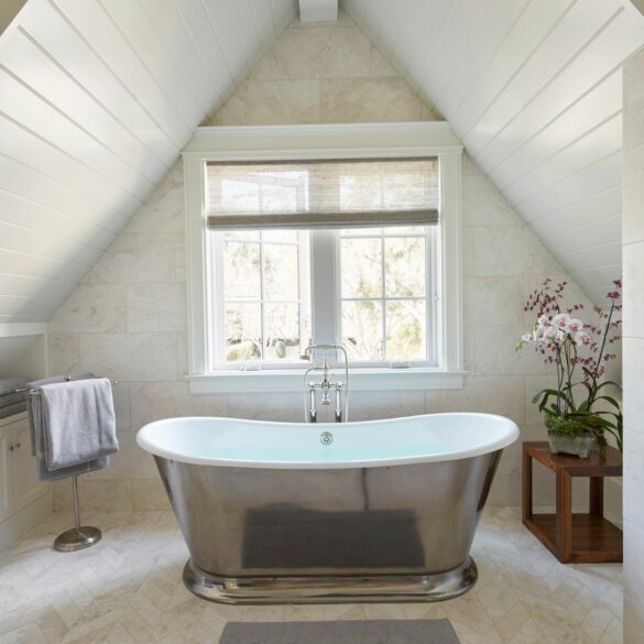 freestanding bathtub microcement floor sloping attic skylight