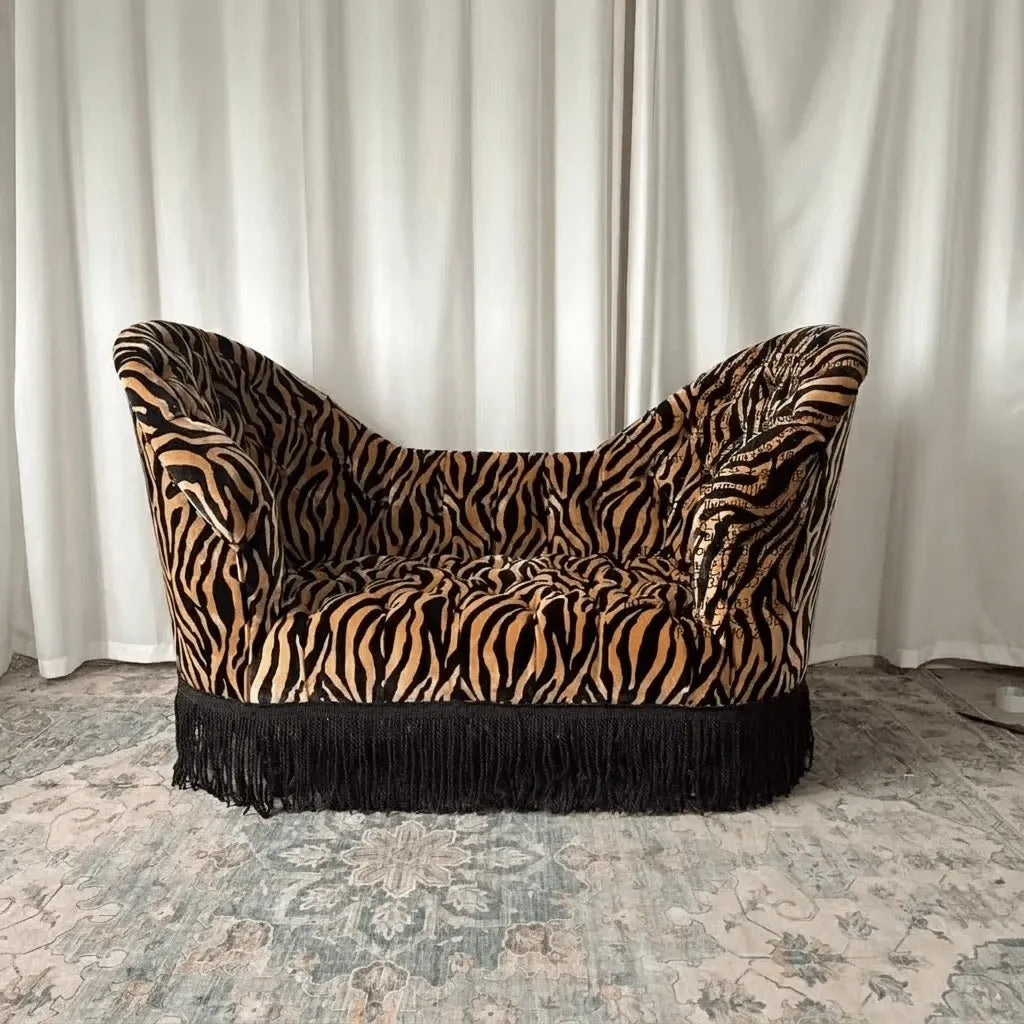 leopard print velvet upholstery on antique curved sofa