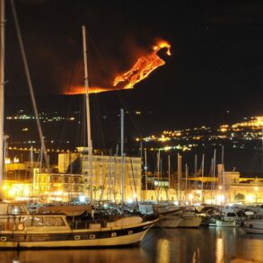 Mount Etna eruption sailboat