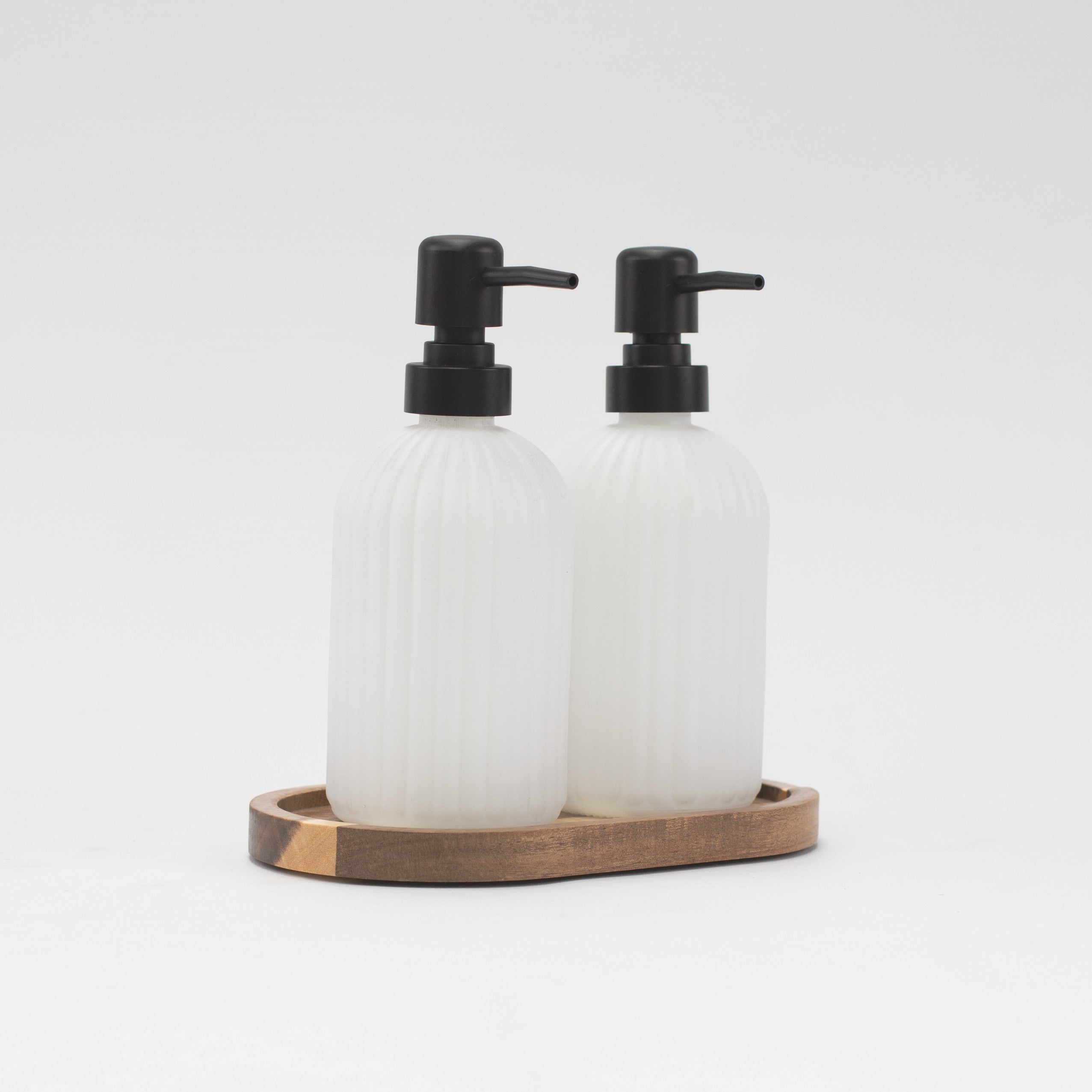 ribbed amber glass soap dispenser on a white