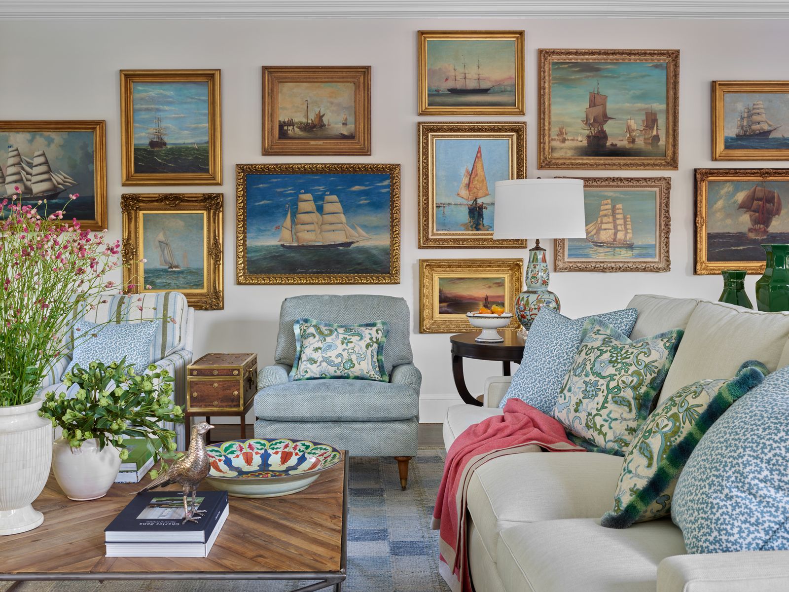 symmetrical gallery wall above velvet sofa