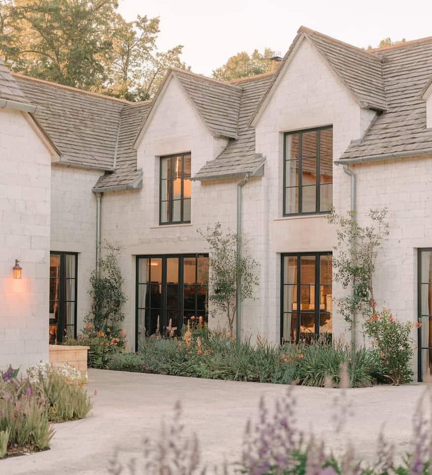white wood mansion facade with black metal window