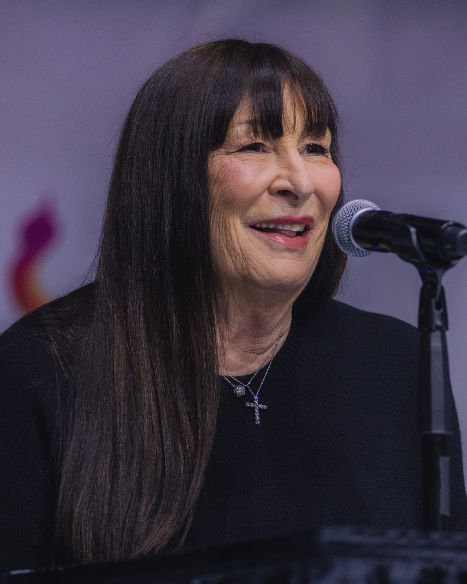 Anjelica Huston, silver tray with crystal wine bottle