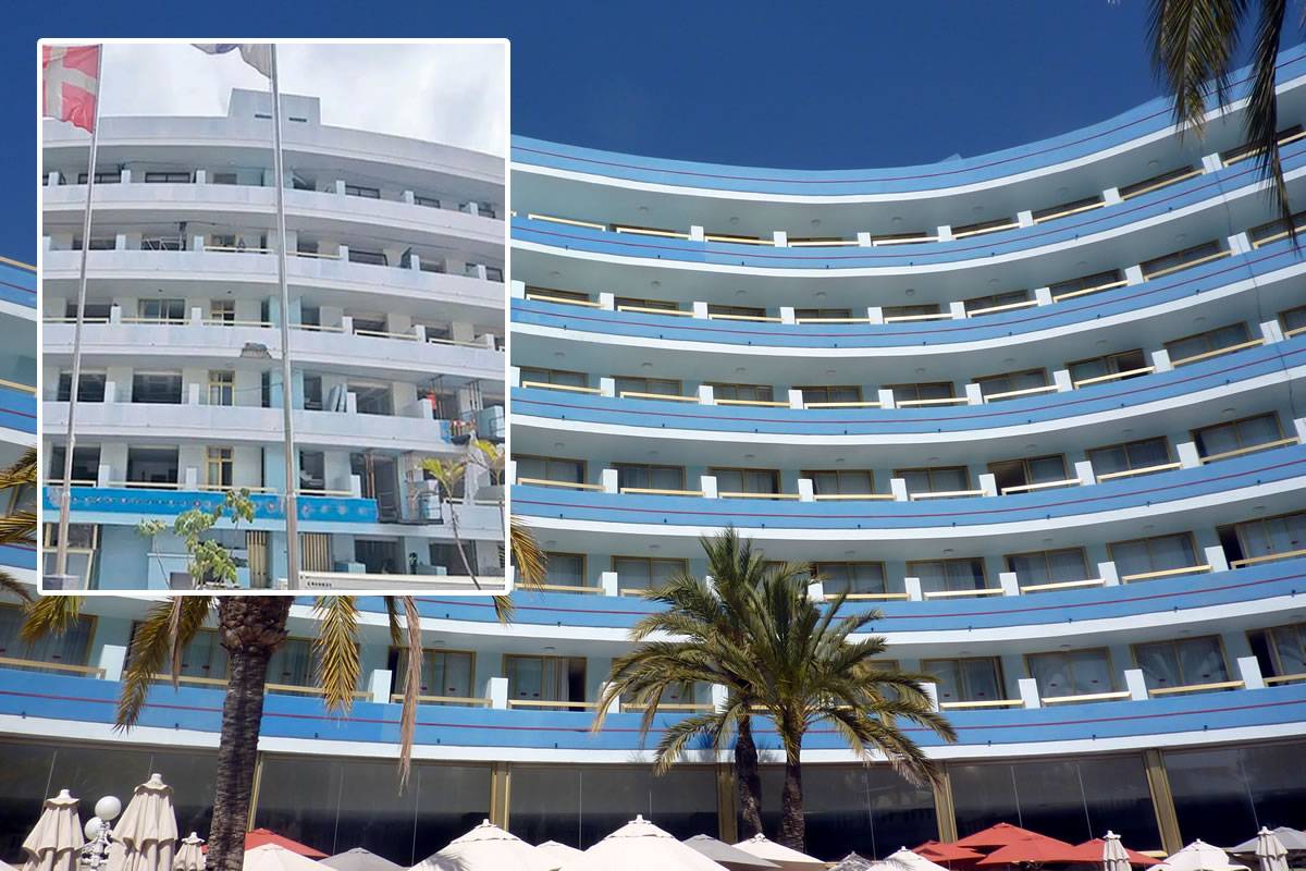 Mediterranean white hotel facade cobalt blue sea